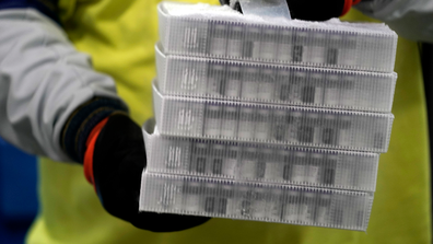 Boxes containing the Pfizer-BioNTech COVID-19 vaccine are prepared to be shipped at the Pfizer Global Supply Kalamazoo manufacturing plant in Portage, Michigan, Sunday, Dec. 13, 2020. (AP Photo/Morry Gash, Pool)