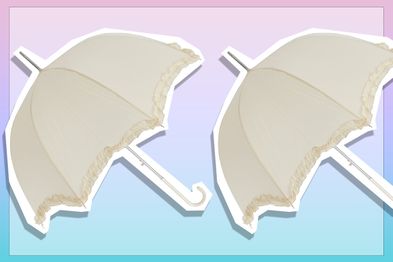 9PR: Women's ivory umbrella with frill trim.