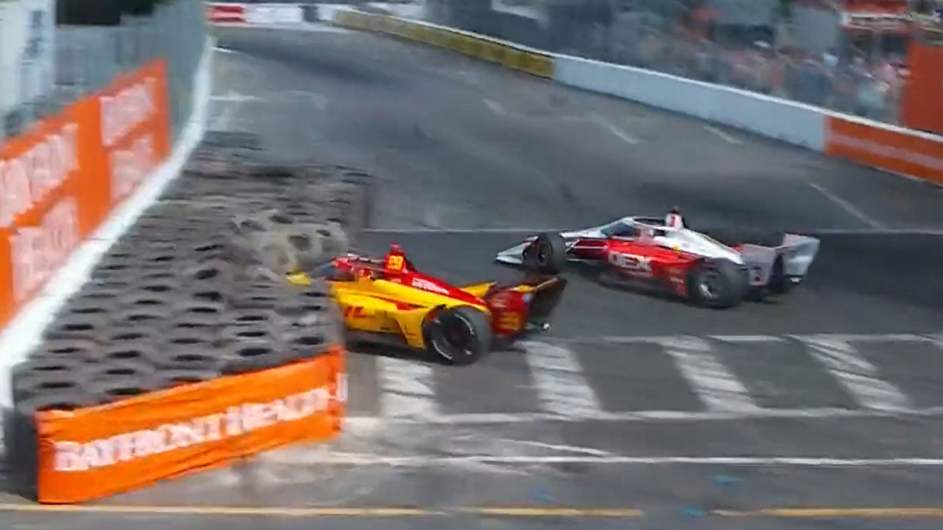Romain Grosjean (left) goes into the tyre wall after contact with Scott McLaughlin.