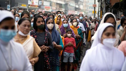 Indian Christians wearing masks as a precaution against COVID-19