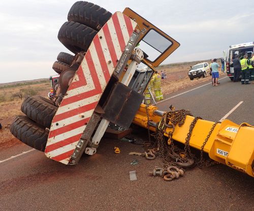 A man is fighting for his life after his crane crashed and rolled.