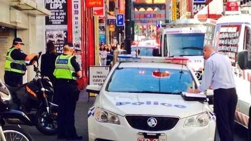 Police and paramedics at the scene of the stabbing in Chinatown. (9NEWS, Andrew Nelson)