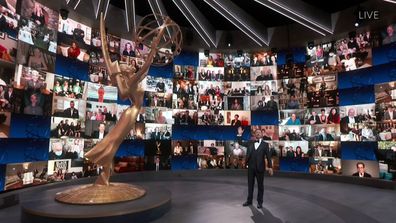 Jimmy Kimmel appears with a screen filled with nominees during the 72nd Emmy Awards broadcast.