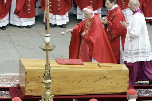 Cardinal Joseph Ratzinger blesses the coffin containing the body of Pope John Paul II during the funeral mass in St. Peter's Square at the Vatican on April 8, 2005. 