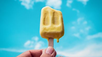 Hand holding Frozen Popsicle Icecream