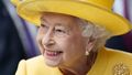 Queen beams in yellow as she opens new train line