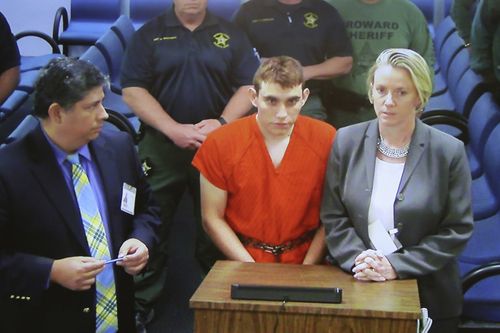 A cuffed Nikolas Cruz appears before a judge charged with 17 counts of premeditated murder. Picture: AAP