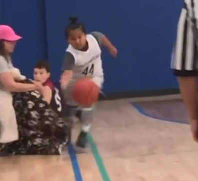 Mum tries to trip 9-year-old playing basketball against her son