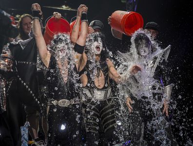 NOBLESVILLE, IN - AUGUST 22: Eric Singer, Paul Stanley and Tommy Thayer of the band KISS participates in the ALS Ice Bucket Challenge at Klipsch Music Center on August 22, 2014 in Noblesville, Indiana. (Photo by Michael Hickey/Getty Images)