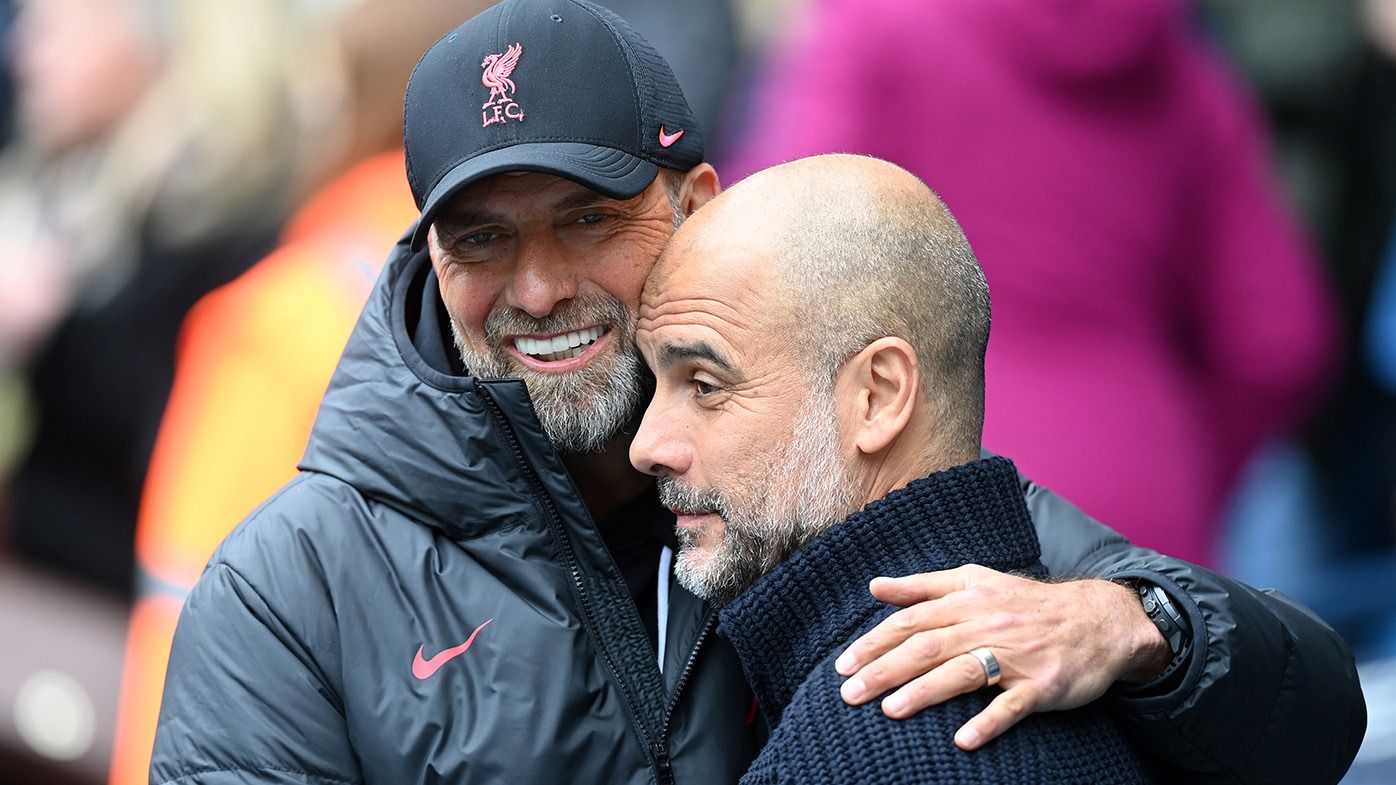 Juergen Klopp, Manager of Liverpool, embraces Pep Guardiola, Manager of Manchester City, prior to the Premier League match between Manchester City and Liverpool FC at Etihad Stadium on April 01, 2023 in Manchester, England. (Photo by Michael Regan/Getty Images)