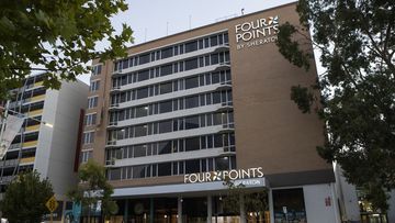 A security guard who contracted COVID-19 at the Four Points by Sheraton hotel was not wearing a mask.