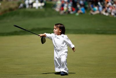 Jason Day's son Dash seemed to know his way around the course. (AAP)