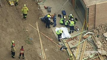 One man dead and another injured after two separate wall collapses in Sydney