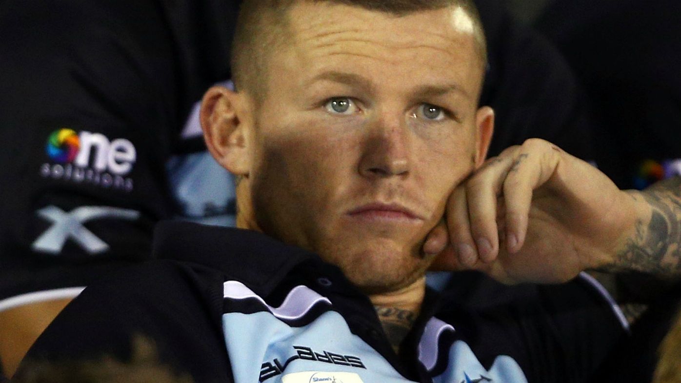 Todd Carney watches on