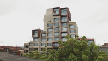 A﻿ former social housing block perched on prime real estate next to the Sydney Harbour Bridge has been transformed into luxury new apartments.