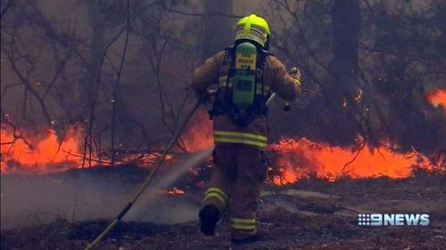 Firefighters have been battling rapid winds, at times in excess of 100km/h, and extremely dry land. 