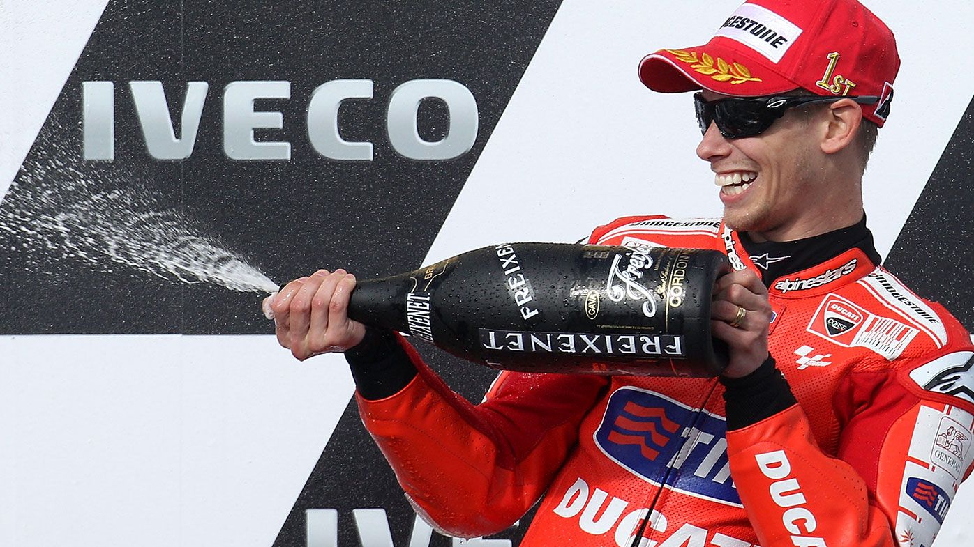Casey Stoner celebrates winning the Australian MotoGP in 2010