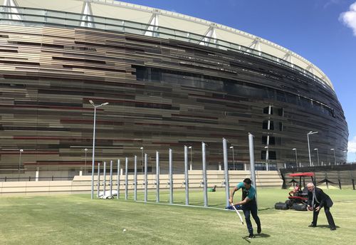 Mitchell Johnson has a hit outside Optus Stadium today. (AAP)