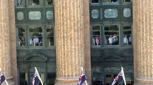 Workers inside a Sydney office building near the siege. (supplied)