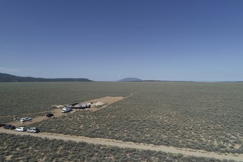 An aerial view shows a makeshift compound in the desert area of Amalia, N.M.