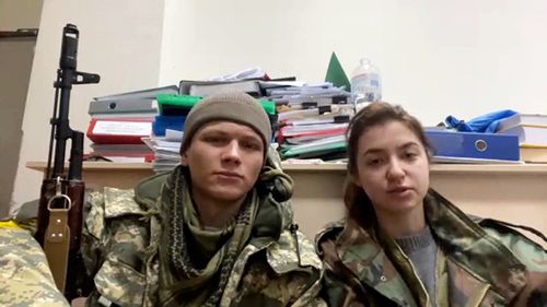 Newlyweds Sviatoslav Fursin (left) and Yaryna Arieva (right) have taken up arms to defend Ukraine