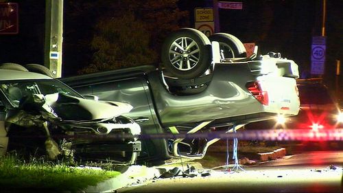 Cars were flipped over in the crash outside the hospital.