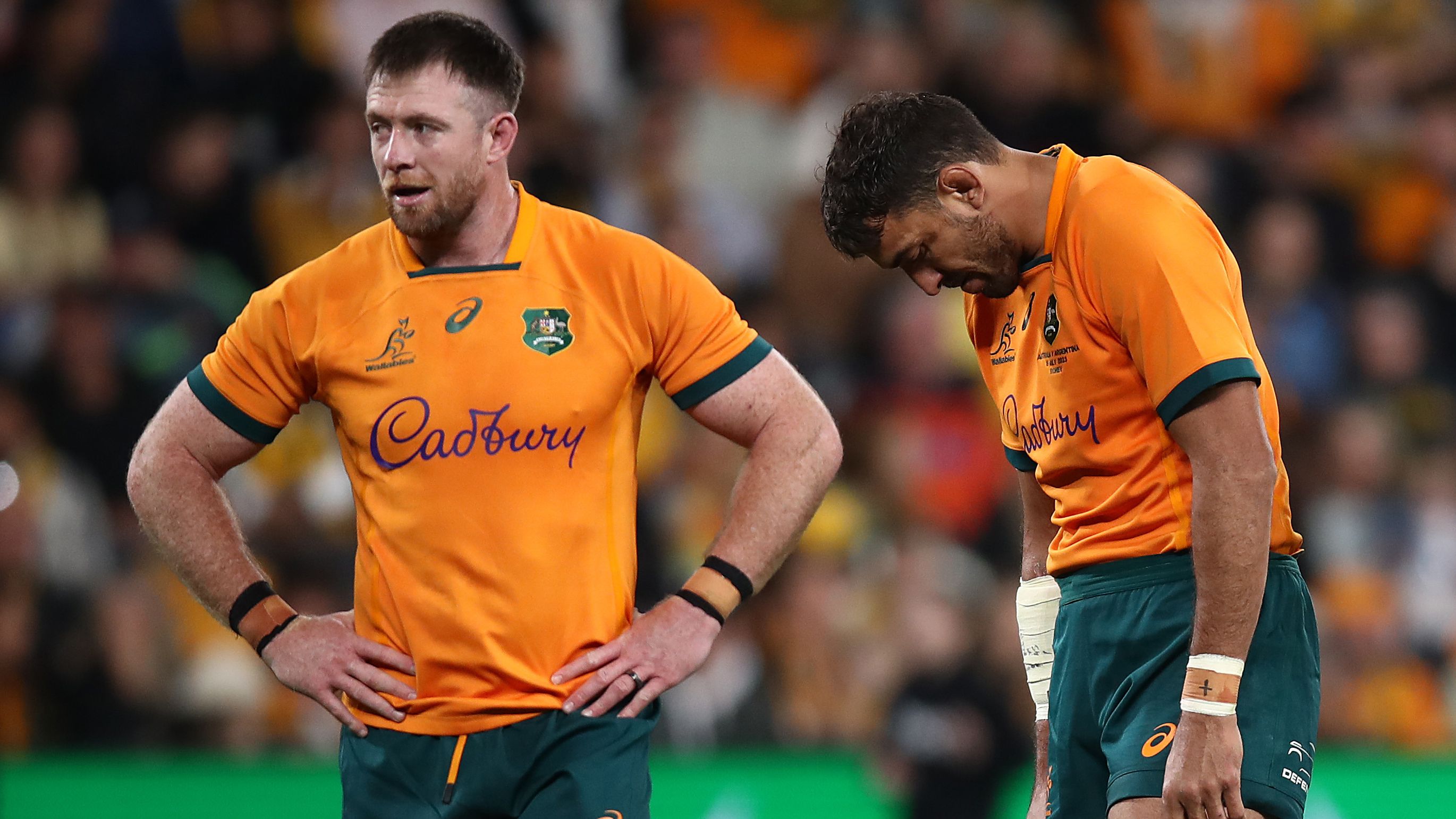 Jed Holloway, Richie Arnold and Carter Gordon of the Wallabies look dejected.