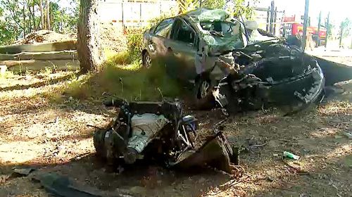 9News understands the woman was driving a car along Tamborine Oxenford Rd at Wongawallan around 7:30am before the vehicle rolled. 