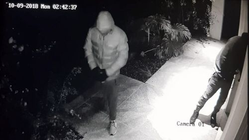 CCTV shows the masked men at the door just moments before they stormed in.