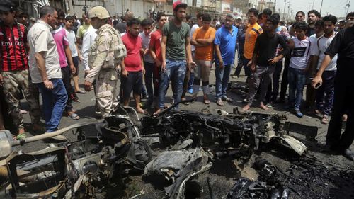 ISIL claims bomb attack at crowded Baghdad market that killed 64