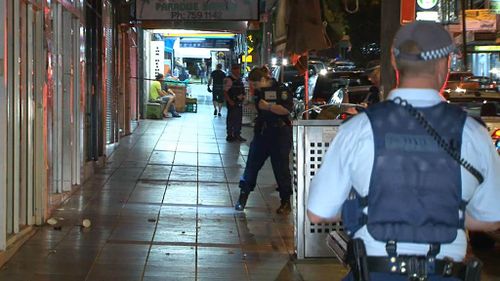 Police seperated 10 men, allegedly brawling in the street in Sydney's southwest. (9NEWS)