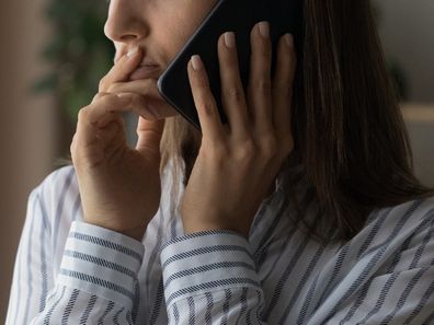 Confused woman using phone