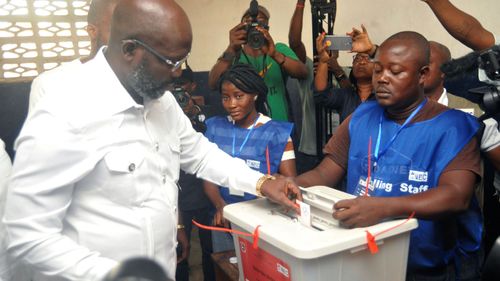Former soccer star George Weah casts his vote. (AP)
