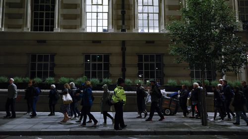 Members of the public stand in the queue in the evening for the Lying-in State of Queen Elizabeth II on September 16, 2022 in London, United Kingdom. Queen Elizabeth II is lying in state at Westminster Hall until the morning of her funeral to allow members of the public to pay their last respects. Elizabeth Alexandra Mary Windsor was born in Bruton Street, Mayfair, London on 21 April 1926. She married Prince Philip in 1947 and acceded to the throne of the Un
