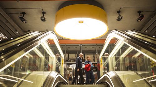 30 November 2025. Passengers at ANZAC station after arriving on the first train to go through the newly opened Metro Tunnel. Photograph by Chris Hopkins