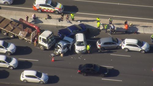 Truck and four cars collide on Sydney's M4 motorway near Merrylands. 