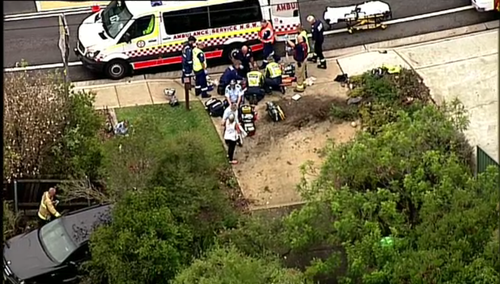 The car was travelling on Berowra Waters Road in Berowra when it careered across a footpath and into a front yard. (9NEWS)