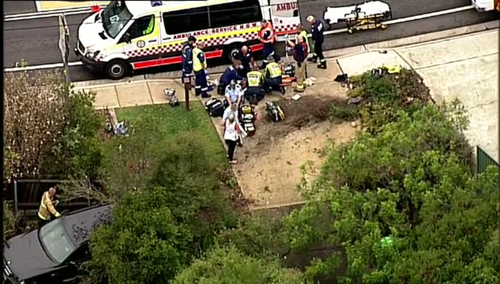 The car was travelling on Berowra Waters Road in Berowra when it careered across a footpath and into a front yard. (9NEWS) 