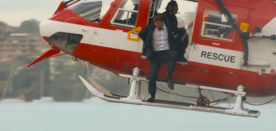 In a scene at the end of the movie, Glen Powell's character flies into the Opera House forecourt on a Surf Lifesaving helicopter, chasing down the love of his life, Sydney Sweeney's ﻿character.