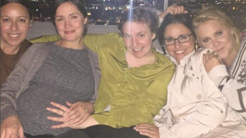 Rose Byrne shows off baby bump in snap with celebrity friends