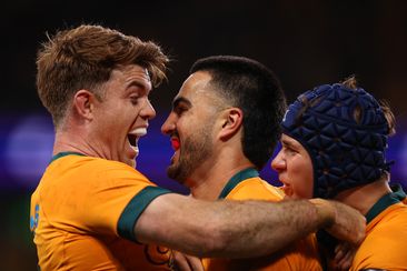 Tom Wright of the Wallabies celebrates with Andrew Kellaway after scoring a try.