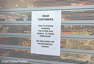 Which supermarket chain's IT outage forced stores to shut on Monday?