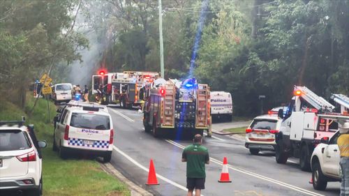 Emergency services on the scene of a two car crash which killed three people in South-East Queensland.