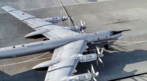 A Russian Tu-95 bomber prepares to fly more than 4000 km to launch cruise missiles at practice targets at a firing range in the Arctic.