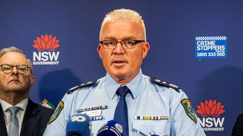 NSW Police Commissioner Mal Lanyon admits police's initial response to the Bondi Beach shooting was limited due to the firepower difference between responding officers and the gunmen.