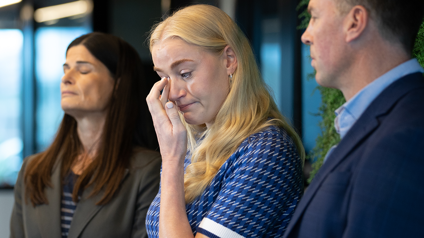 Jo Weston wipes a tear away during an ANPA press conference.