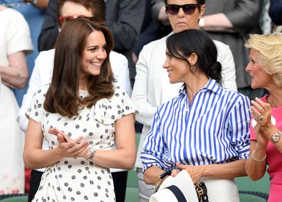 Kate, the Princess of Wales and Meghan, Duchess of Sussex at Wimbledon on July 14, 2018 in London, England.  (Photo by Karwai Tang/WireImage )