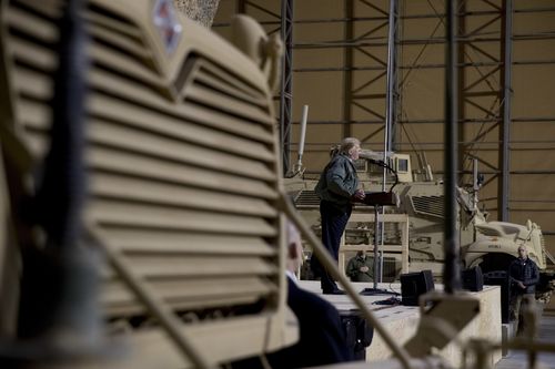 Mr Trump speaks to troops at a hanger rally at Al Asad Air Base.