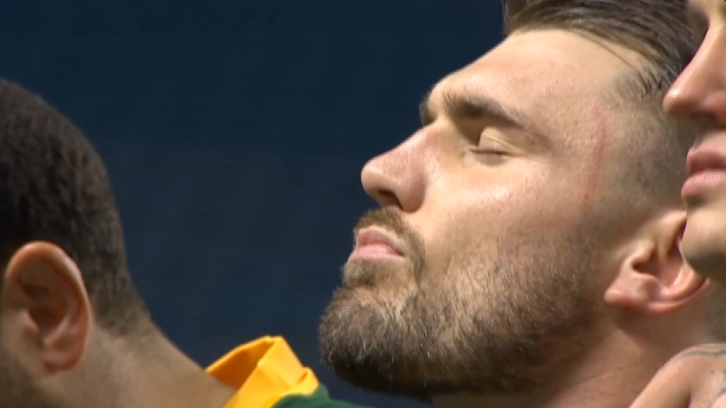 James Tedesco looked visibly emotional during the moments silence for Liam Hampson ahead of the Rugby League World Cup clash between the Kangaroos and Scotland.