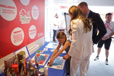 Catherine, Duchess of Cambridge, Princess Charlotte of Cambridge and Prince William, Duke of Cambridge take part in an interactive learning experience during a visit to SportsAid House at the 2022 Commonwealth Games on August 02, 2022 in Birmingham, England. 